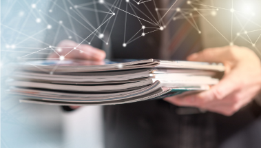 A healthcare professional holding latest scientific publication